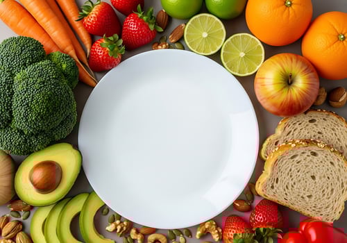 Healthy food assortment surrounding empty white plate isolated on white background photo