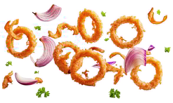 Crispy Golden Onion Rings, Red Onion Slices, and Fresh Parsley Flying on White photo