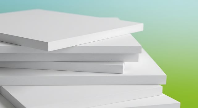 Clean Geometric Stack of White Panels Against a Soft Blue-Green Gradient photo