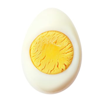 Perfectly cooked hard-boiled egg half with vibrant yellow yolk, isolated on white photo