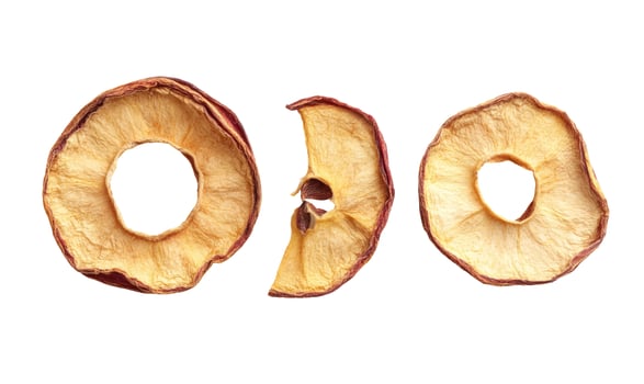 Three Dried Apple Slices on White Background, Close-Up Food Photography photo