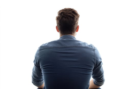 Man seen from behind wearing a denim shirt, isolated on white background photo