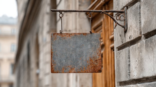 Rustic Blank Metal Sign Hanging On Stone Wall. Vintage Signage For Customization In Urban Setting photo