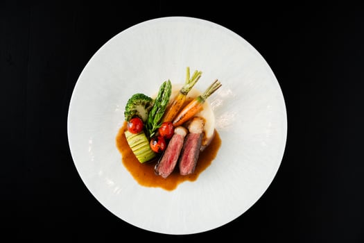 Grilled Steak with Mashed Potatoes and Roasted Vegetables on White Plate photo