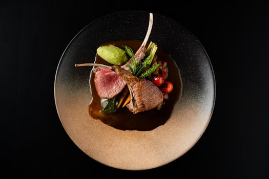 Gourmet Lamb Chops with Roasted Vegetables and Creamy Sauce photo