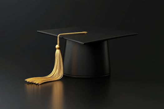 Black graduation cap with a gold tassel on a dark background photo