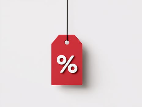 Red price tag with percentage sign on white background photo