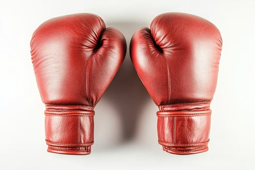 A pair of red boxing gloves isolated on a white background photo