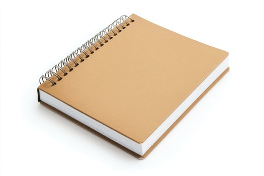 Spiral bound notebook with a brown cover isolated on white background photo