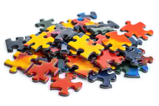 Pile of colorful jigsaw puzzle pieces isolated on white background photo