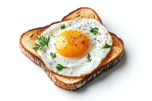 Fried egg on toast with parsley garnish isolated on white background photo