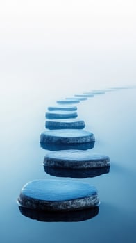 Blue stepping stones cross the calm blue water reflecting serenity and peacefulness in this photo