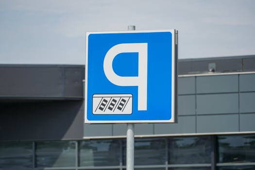 A blue and white parking sign photo