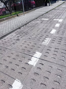 A street with a sidewalk and a road photo