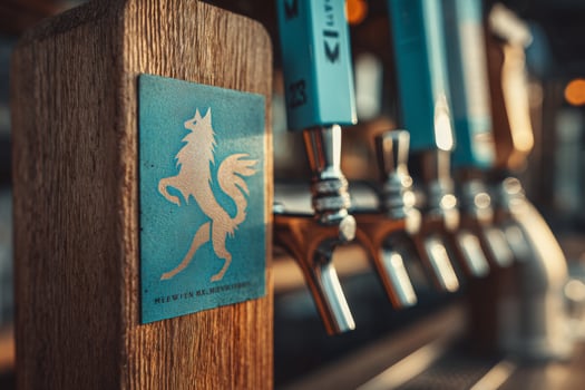 A beer tap with a blue and white horse on it photo