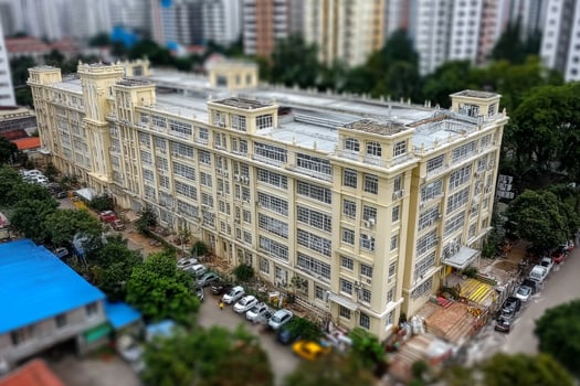 An aerial view of a large building in a city photo