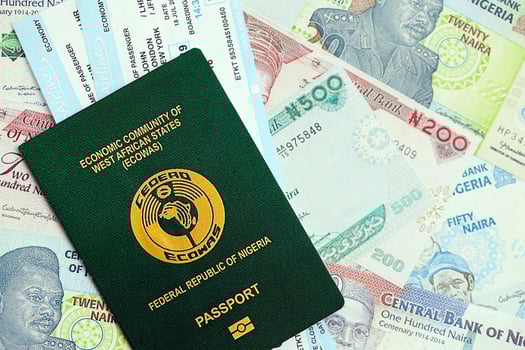 Nigerian naira currency money bills with tickets and passport. The concept of travel and vacation photo