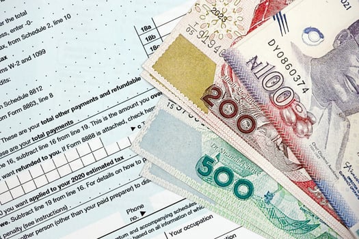 Nigerian naira on tax form. Taxation and accounting concept photo