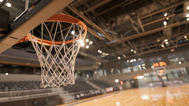 View of a basketball hoop on an empty basketball court before a match photo