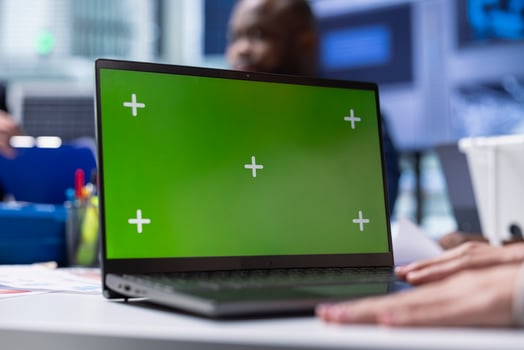 Factory expert researches new photovoltaics materials on chroma key notebook, close up. Solar panel plant specialist using green screen laptop, developing new solar energy systems prototypes photo