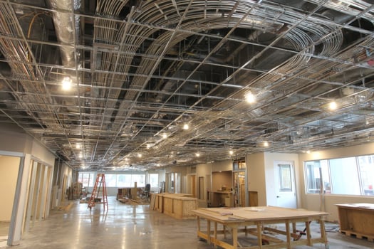 A large room with lots of wires and pipes photo