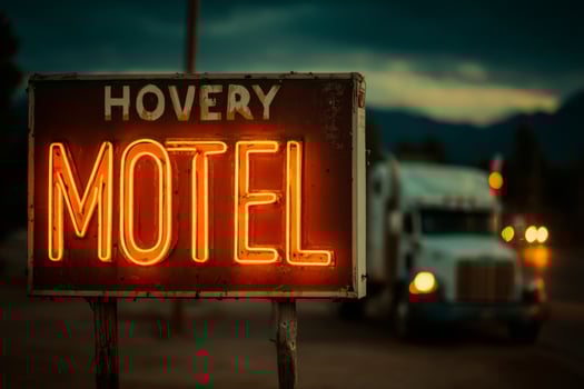 A neon sign that says hovey motel photo