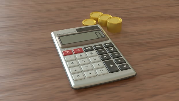 The Calculator and gold coins for earn or Business concept 3d Rendering. photo
