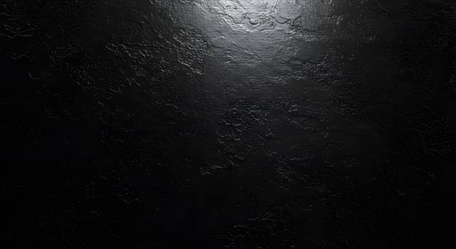Dark textured surface with a spotlight photo