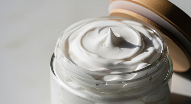 A jar of whipped cream on a table photo