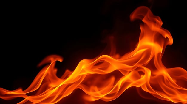 A close up of a fire on a black background. photo