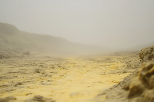 Misty Haze Over Yellow Earth and Rugged Terrain. photo
