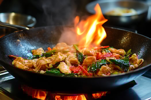 Sizzling Stir Fry Flames Dance in a Wok with Chicken and Noodles photo