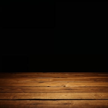 Empty wooden tabletop on black background for product placement photo