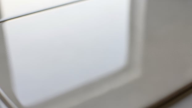 A white window with a reflection of a white wall photo