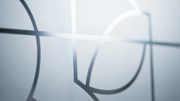 A close up of a glass door with a pattern on it photo