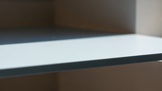 A shelf with a light blue color on it photo