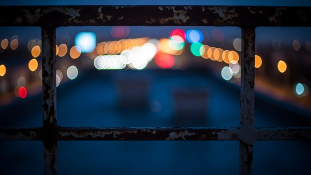 A view of the city lights through a window photo