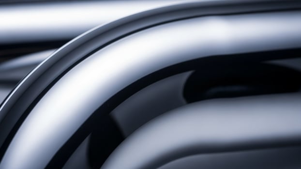 A close up of a shiny metal pipe photo