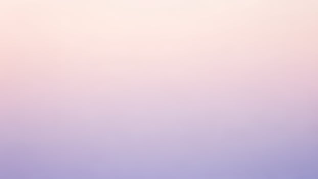 A purple and pink blurred background with a blurred sky photo