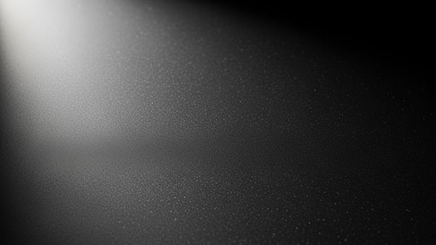 Black and white photo of a spotlight shining on a dark background