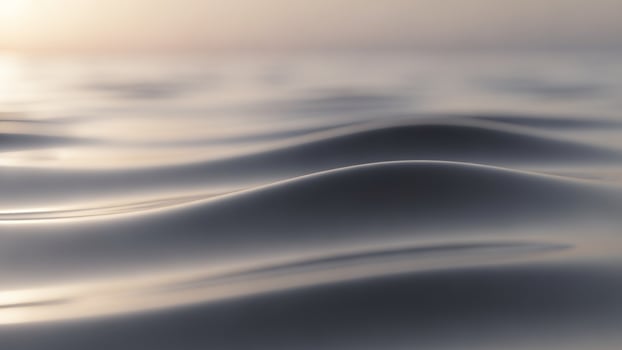 A wave is moving across the surface of the water photo