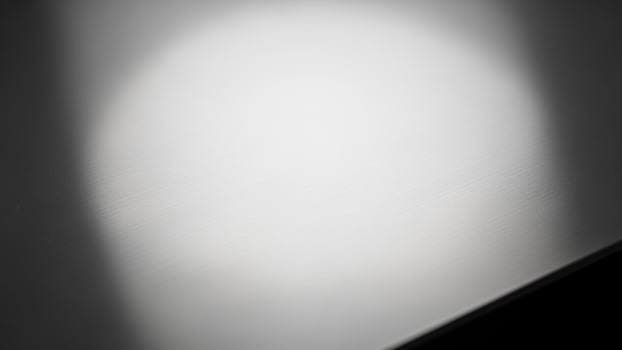A black and white photo of a white surface
