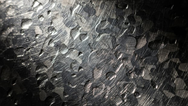 A close up of a metal surface with scratches photo