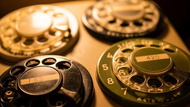 Old rotary phones in a vintage phone booth photo