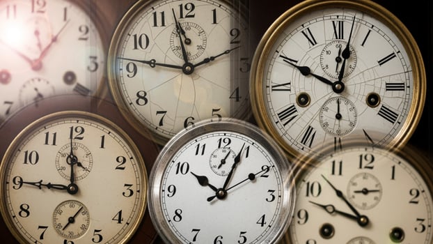 A group of clocks with different faces photo