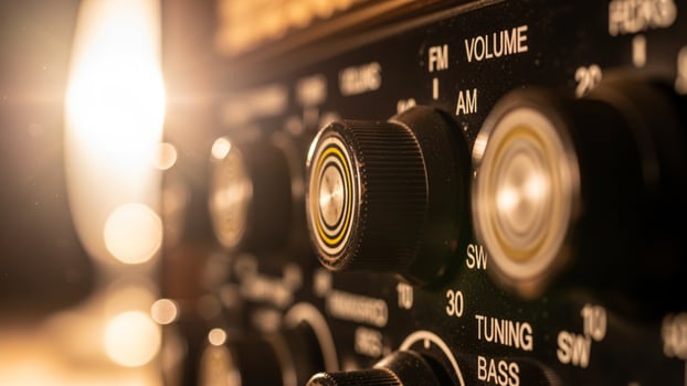 An old radio with many knobs and buttons photo