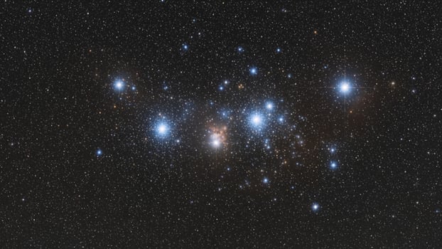 The orion cluster, a group of stars in the night sky photo