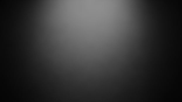 Black and white photo of a spotlight on a black background