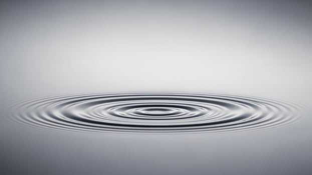 A circular ripple in water with a white background photo