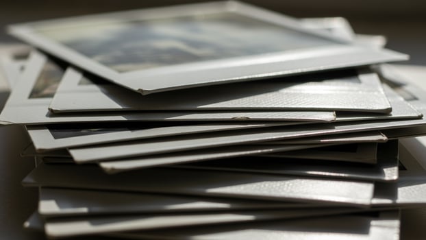 A stack of polaroid photos